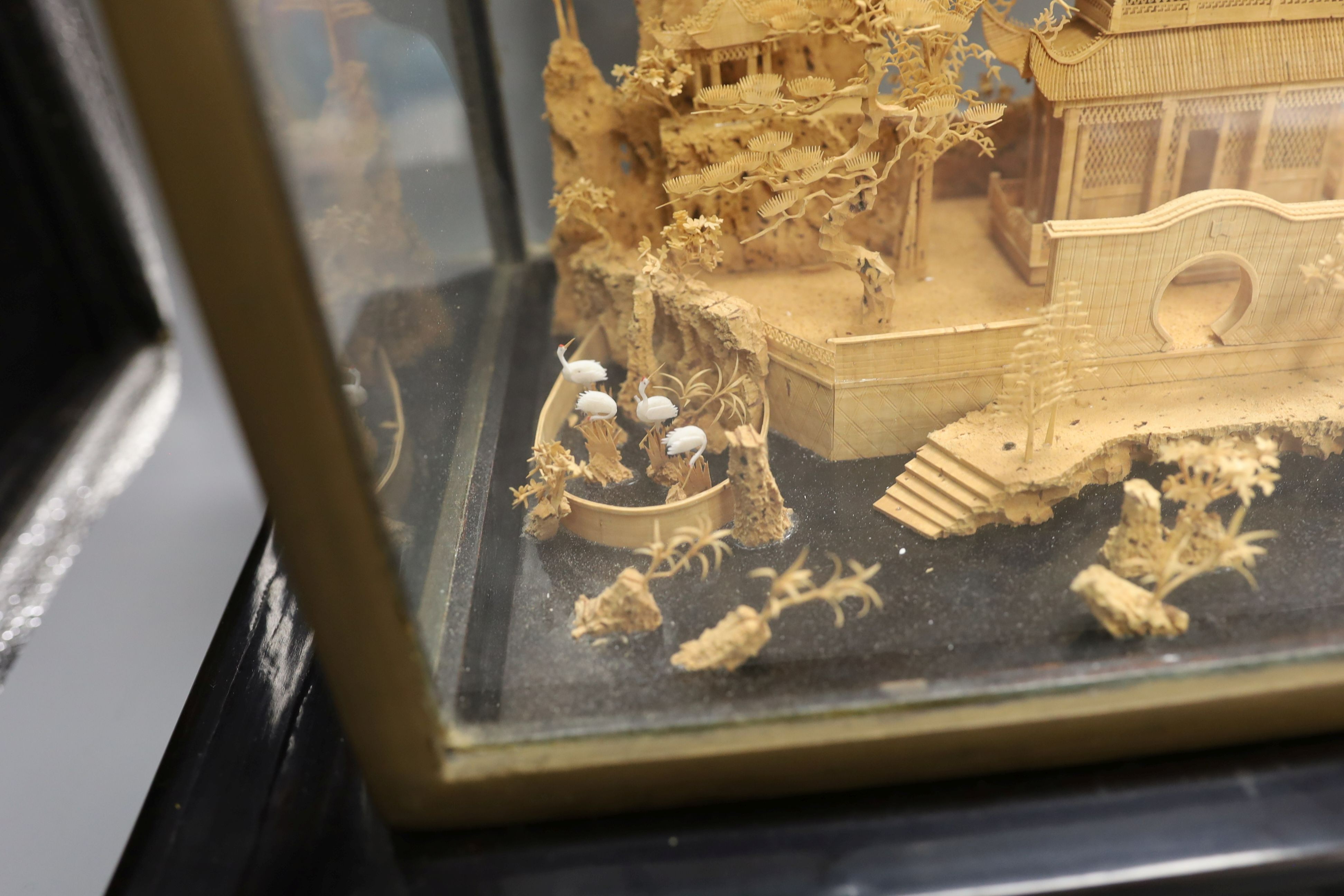 A large Chinese export Ruanmu Hua carved cork diorama, depicting a pagoda on stand - 35.5cm tall including case